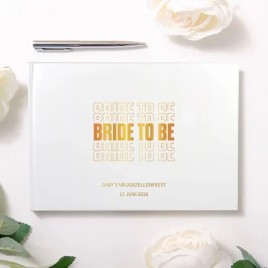 Wit gastenboek met gouden tekst 'Bride to Be' en vrijgezellenfeest details