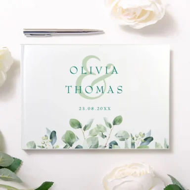 Wit gastenboek met elegant eucalyptus design en namen in modern lettertype