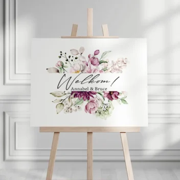 Welkomstbord met roze pioenrozen frame en elegante tekst Welkom en namen in romantisch lettertype