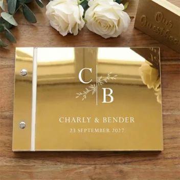 Gastenboek mirror acryl botanisch monogram goud met witte bedrukking gepersonaliseerd met initialen namen en datum